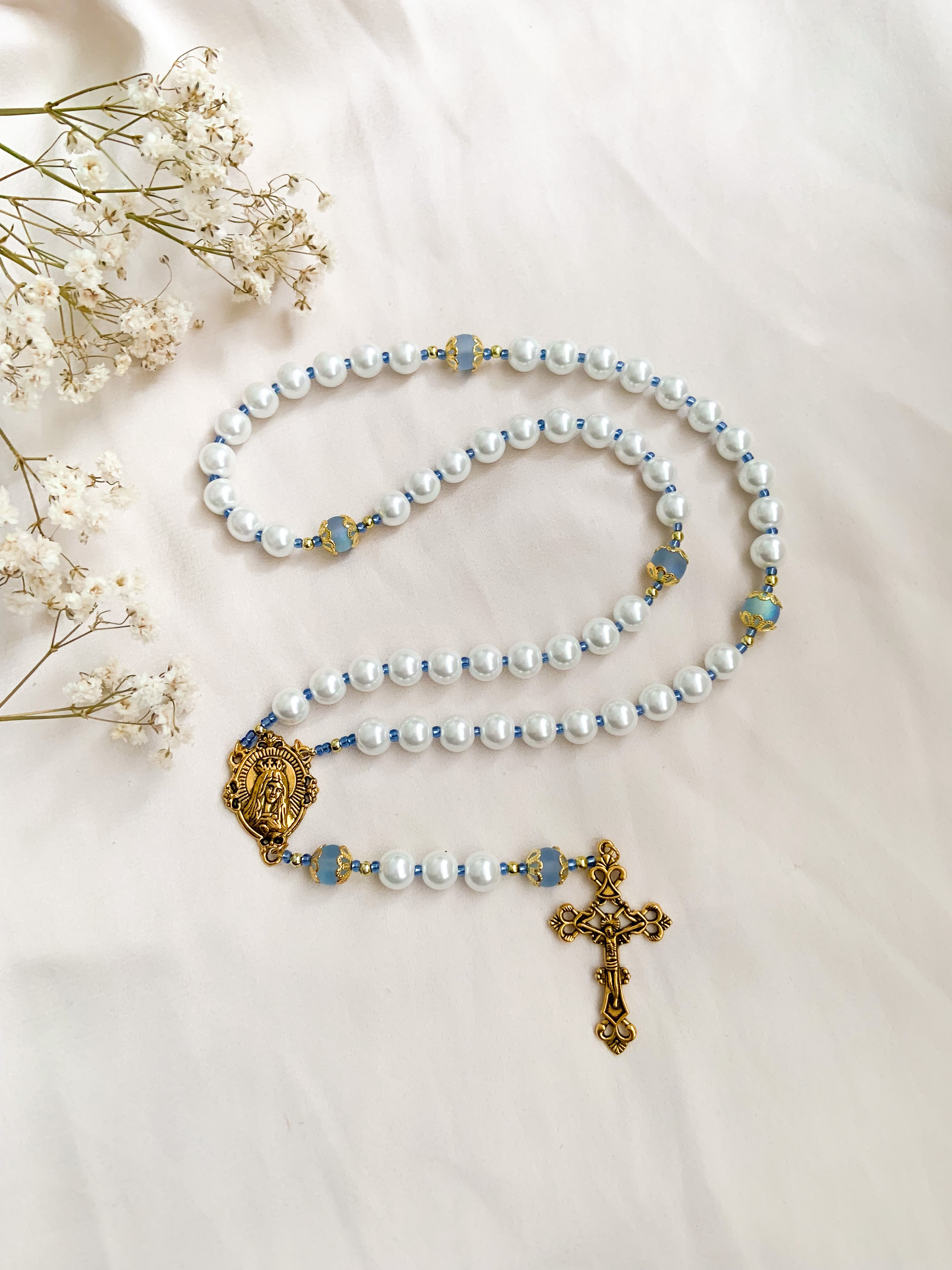 Queen of Heaven parishioners craft, donate rosaries by the thousands